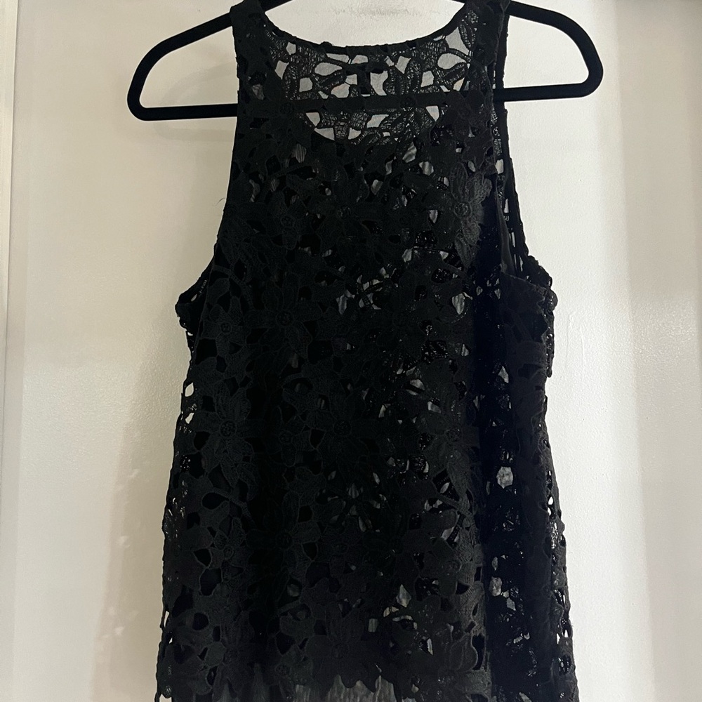 Flower cutout sheer peplum top.
